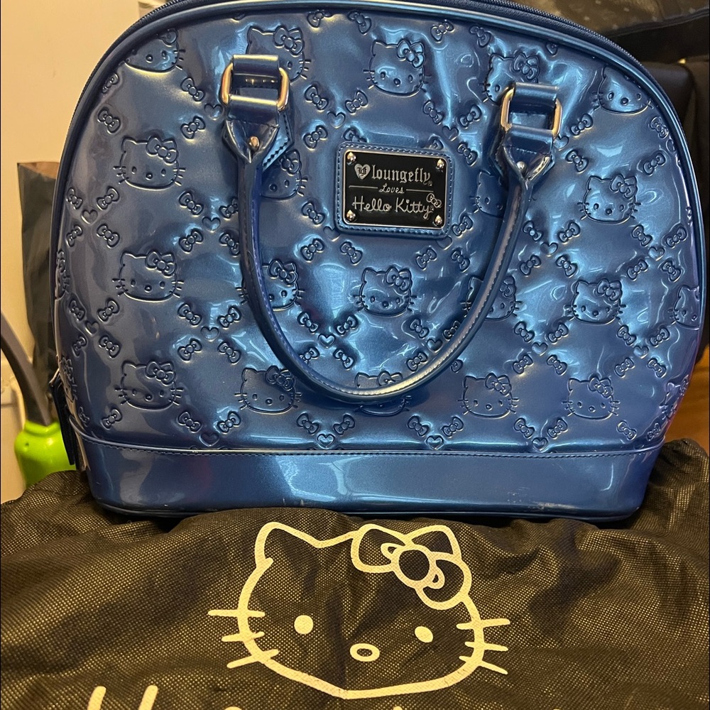 Authentic Hello Kitty Purse. Original tags. Dust bag included